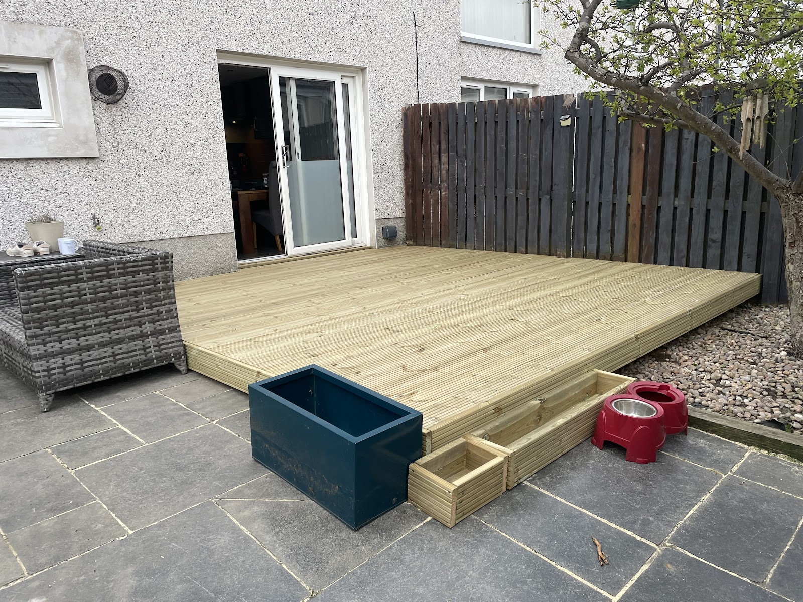 New timber decking and dark timber fence