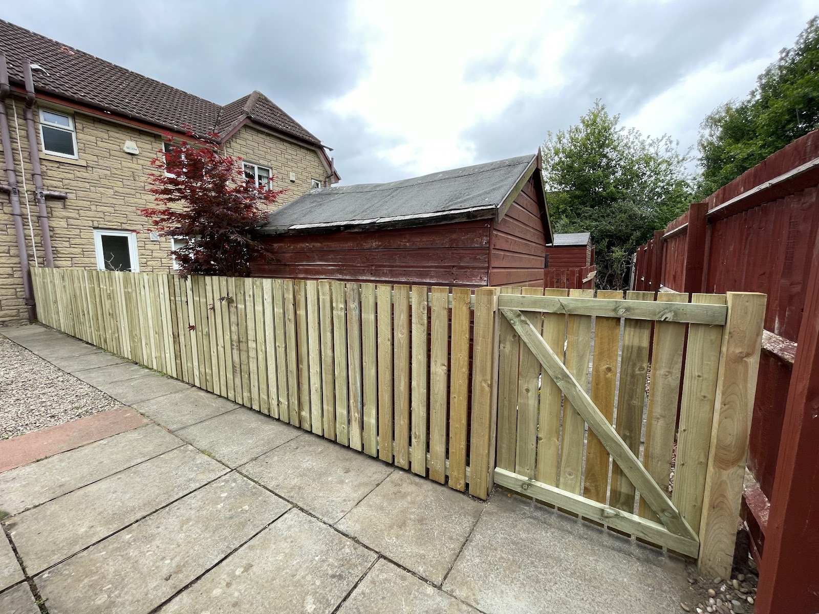 New slatted timber fence and matching garden gate