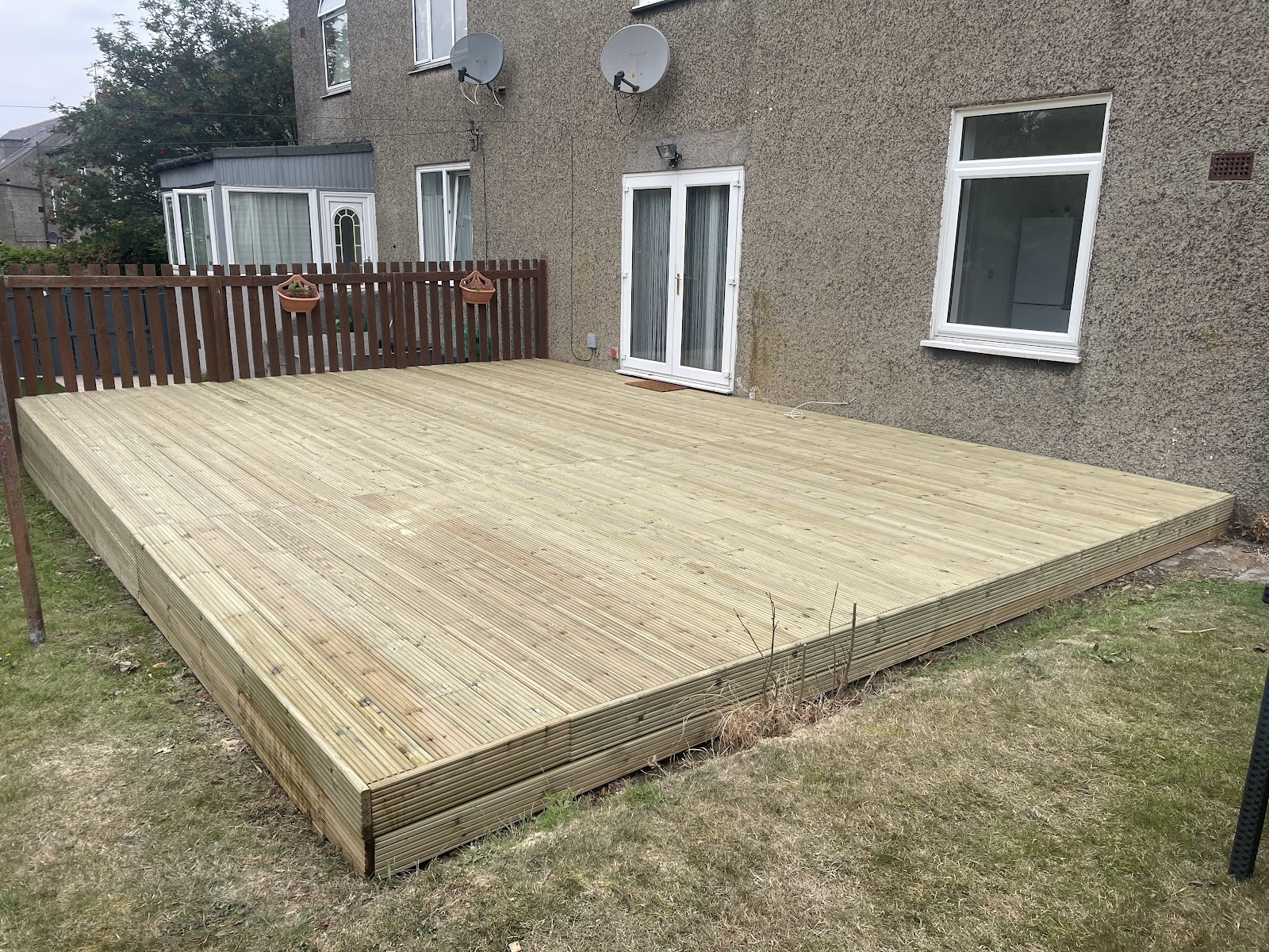 Large newly built timber deck beside a home