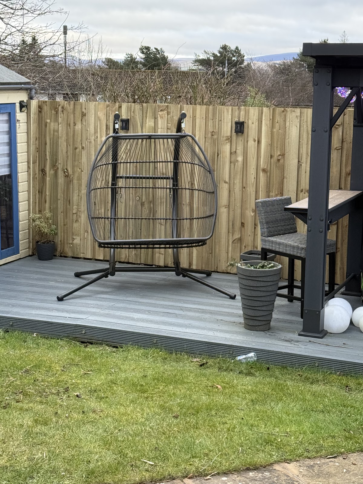Grey composite decking in a landscaped garden